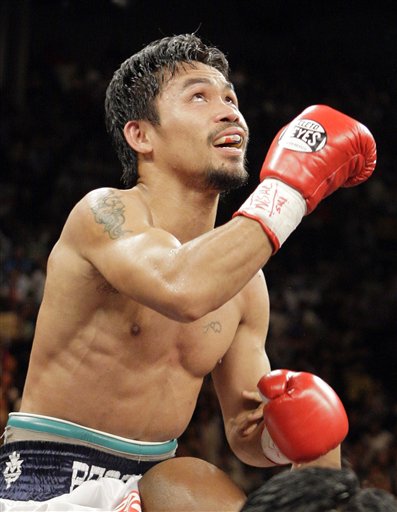 Manny Pacquiao, of the Philippines, celebrates after beating British boxer Ricky Hatton by TKO in the second round of their junior welterweight title boxing match Saturday, May 2, 2009, at the MGM Grand in Las Vegas. (AP Photo/ Jae C. Hong )